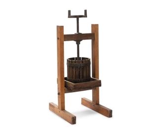 4010
An Antique Fruit Crusher/Cider Or Wine Press
Late 19th/early 20th century
Comprising of an oak stand, pressing plate, and pressing cage with a cast iron threaded spindle
43.25" H x 15" W x 24" D
Estimate: $400 - $600