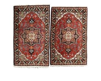 4032
A Pair Of Heriz Area Rugs
Late 20th century
Each wool on cotton foundation, with a cream, tan, and black petal medallion on a red field, 2 pieces
Larger: 5'2" L x 3' W; smaller: 5' L x 3' W
Estimate: $300 - $500