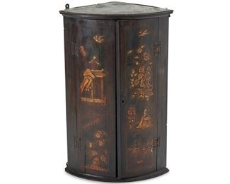 4033
An English Chinoiserie Corner Cupboard
Late 19th century
The hanging cabinet with two doors decorated with lacquered, Chinoiserie figural scenes concealing two interior shelves
36.25" H x 23.5" W x 15.5" D
Estimate: $300 - $500