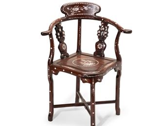 4035
A Chinese Mother-Of-Pearl Inlaid Corner Chair
20th century
The carved hardwood chair inlaid with scenes of branches, flowers, and birds
33" H x 21" W x 21" D
Estimate: $200 - $400