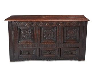 4046
An English Carved Oak Bridal Chest
18th century or earlier
With paper label verso: Reeve's Depositories / Wokingham & Camberley
The hinged-top chest with carved panels of floral medallions, with an upper compartment over three drawers
33" H x 63" W x 24.5" D
Estimate: $800 - $1,200