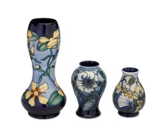 4048
A Group Of Moorcroft Pottery Vases
Circa 1990s; Burslem, England
Each with Moorcroft backstamp
Each glazed ceramic, comprising a hypericum vase, a rough hawksbeard vase, and one with blue flowers, 3 pieces
Largest: 11.25" H x 5" Dia.
Estimate: $200 - $300