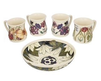 4050
A Group Of Moorcroft Pottery
Late 20th/early 21st century; Burslem, England
Each with Moorcroft backstamp; with further various dates and markings
Each glazed ceramic with various floral motifs, comprising four mugs and a juneberry bowl, 5 pieces
Largest: 3.5" H x 10.25" Dia.
Estimate: $300 - $500