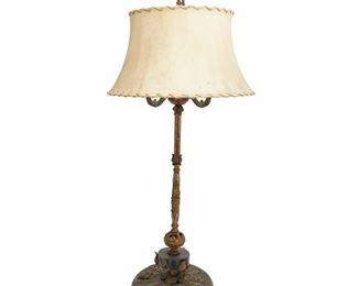 4065
An Art Deco Oscar Bach-Style Lamp
Circa 1920s-1930s
Gilt cast bronze body with green and white painted accents with a black marble cylindrical platform and hide shade, electrified
38" H x 11" Dia.
Estimate: $300 - $500