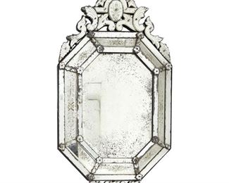 4069
A Venetian Wall Mirror
20th century
The Italian multi-panel mirror in octagonal form with a scrolled foliate crest
51" H x 28.5" W x 3" D
Estimate: $300 - $500