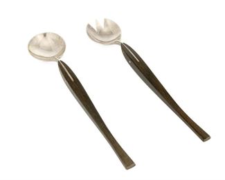 4079
A Wood Handled Sterling Silver Salad Serving Set
Mid-20th century
Each marked: Sterling
Each with a carved wood, shaped handle, 2 pieces
Each: 13.375" L
7.72 gross oz. troy approximately
Estimate: $200 - $400