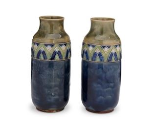 4088
A Pair Of Royal Doulton Pottery Vases
Circa 1920s
Each marked for Royal Doulton
Each glazed stoneware vase with geometric band to shoulder, 2 pieces
Each: 10" H x 4" Dia.
Estimate: $200 - $300