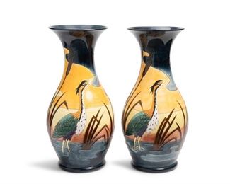 4090
A Pair Of Large Moorcroft Pottery Urns
1995
Each with Moorcroft backstamp; with further various dates and markings
Each monumental glazed ceramic urn depicting ducks and a heron with cattails in an estuary at sunset, 2 pieces
Each: 26.25" H x 10.5" Dia.
Estimate: $600 - $800