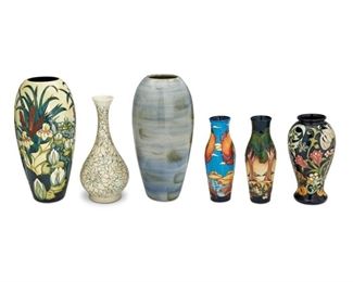 4110
A Group Of Moorcroft Pottery Vases
Late 20th/early 21st century; Burslem, England
Each with Moorcroft backstamp; with further various dates and markings
Each glazed ceramic, comprising a tall cattails vase, a tall blue vase, a white tapered floral vase, a black tapered floral vase, a two autumn landscape vases, 6 pieces
Largest: 14.5" H x 6" Dia.
Estimate: $300 - $500