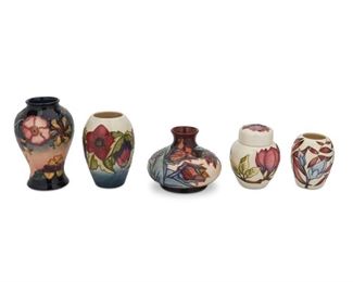 4114
A Group Of Moorcroft Pottery Vases
Late 20th/early 21st century; Burslem, England
Each with Moorcroft backstamp, with further various dates and markings
Each glazed ceramic with varying types of floral designs, comprising four vases and one lidded jar, 5 pieces
Largest: 6.25" H x 4" Dia.
Estimate: $200 - $300