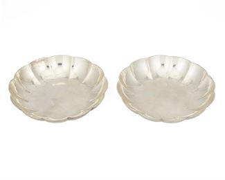 4117
A Pair Of Tiffany & Co. Scalloped Bowls
Circa 1907-1947, directorship of John C. Moore II
Each marked: Tiffany & Co. / Makers / Sterling Silver / 22951 / M / [star]
Each low bowl with a scalloped body, 2 pieces
Each: 1" H x 5.25" Dia.
10.355 oz. troy approximately
Estimate: $400 - $600