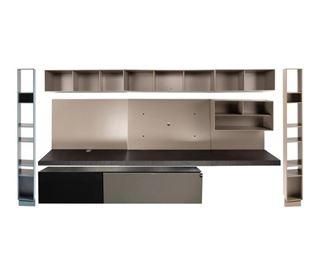4132
A Sangiacomo "Boiserie" Modular Storage System
21st century
With manufacturer's label to verso: Boiserie / 5620 / P5620A / 29-1-P2 / AL / XP
The composite wood storage system comprised of wall mounted shelving units, shelving towers, and a cabinet with grey acrylic accents, 10 pieces
75.5" H x 151.25" W x 19" D
Estimate: $3,000 - $4,000