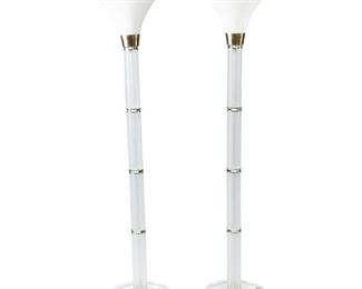4135
Two Contemporary Acrylic And Glass Torchieres
Late 20th/early 21st century
Each with frosted acrylic columns, brass collars, and trumpet milk glass shades, electrified, 2 pieces
Each: 66.5" H x 13.75" Dia.
Estimate: $400 - $600