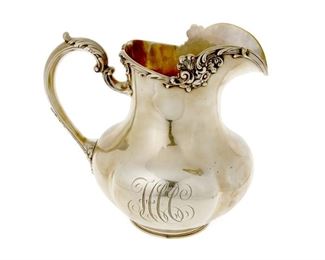 4162
A Gorham Rococo-Style Sterling Silver Pitcher
Mid-20th century
Marked for Gorham and sterling, numbered: A3142
The Rococo-style pitcher with lobbed body and floral rim
8.75" H x 9.5" W x 6.5" D
30.685 oz. troy approximately
Estimate: $500 - $700