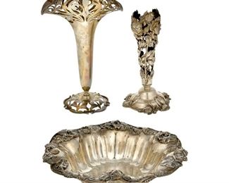 4166
A Group Of American Sterling Silver Holloware
Early 20th century
Each marked for sterling, with various maker's marks
Each with floral Art Nouveau designs, comprising two trumpet vases and a bowl, 3 pieces
Largest: 12.375" H x 7.875" W x 5.125" D
35.425 oz. troy approximately
Estimate: $500 - $700