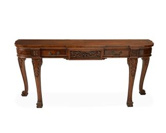 4174
A Karges Demi-Lune Console Table
Late 20th century
With Karges metal factory tag
The carved wood console table with pecan-tone finish and one long frieze drawer
32.5" H x 72" W x 19" D
Estimate: $400 - $600