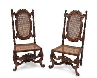 4173
A Pair Of Baroque-Style Carved Wood And Cane Chairs
19th century or earlier
Each carved wood carcass with scrolled foliate motifs enclosing a cane back and seat, 2 pieces
Each: 48.75" H x 27.5" W x 20" D
Estimate: $500 - $700
