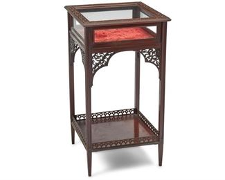 4175
A Carved Mahogany Table Vitrine
Late 19th/early 20th century
With hinge-top glass case, red velvet interior, and fretwork carved borders and corbels
29.25" H x 16" W x 16" D
Estimate: $400 - $600