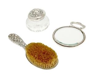 4183
Three Sterling Silver Vanity Items
20th century
Each marked for sterling
Comprising a hand mirror, a brush, and a lidded glass box, 3 pieces
Largest: 9.5" L x 3.25" W x 2" D
26.92 gross oz. troy approximately
Estimate: $300 - $500