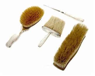 4184
Four Sterling Silver Vanity Items
20th century
Each marked for sterling
Comprising three brushes and a button hook, 4 pieces
Largest: 7.5" L x 2.25" W x 2.25" D
14.54 gross oz. troy approximately
Estimate: $200 - $300