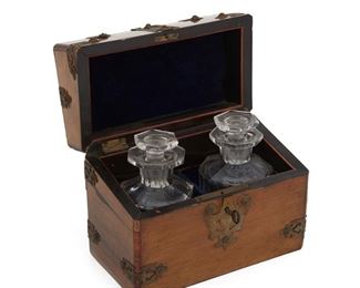 4187
A Continental Apothecary Set
Late 19th/early 20th century
Comprising two glass stoppered flacon bottles housed in a brass-clad wood case
Case: 5.75" H x 7.5" W x 4.25" D
Estimate: $400 - $600