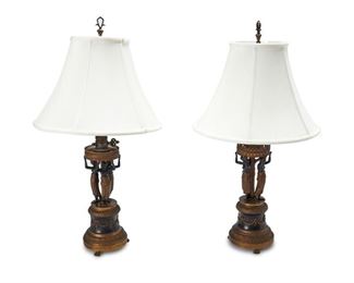 4193
A Pair Of French Empire-Style Bronze Table Lamps
Early 20th century
Each with a circle of caryatid figural supports on a pedestal base, together with contemporary ivory silk shades, electrified, 2 pieces
Each overall: 31" H x 16" Dia.; Each base: 31" H x 6.5" Dia.; Each shade: 11" H x 16" Dia.
Estimate: $400 - $600