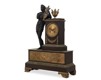 4197
A French Empire-Style Mantel Clock
Circa 1830s-40s
Movement marked: H [obscured] MON / a Paris
The clock with gilt-metal dial with black Roman numeral hour markers and two train movement set in a tired metal case surmounted by a standing figure with lyre and gilt-bronze mounts
20.5" H x 14.5" W x 5.5" D
Estimate: $800 - $1,200