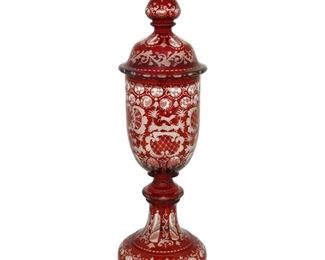 4206
A Bohemian Cut-Glass Lidded Vase
Late 19th/early 20th century
The art glass vase intaglio cut from ruby to clear with floral motifs centering deer, dogs, and castles
17.5" H x 5.5" Dia.
Estimate: $400 - $600