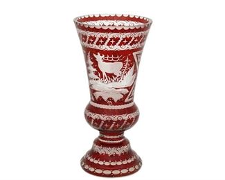4210
A Bohemian Cut-Glass Vase
Late 19th/early 20th century
Engraved signature: MS
The art glass vase intaglio cut from ruby to clear with floral motifs centering a stag
8.125" H x 4.125" Dia.
Estimate: $300 - $500
