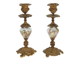 4212
A Pair Of French Gilt-Bronze And Porcelain Candlesticks
Early 20th century
Each gilt-bronze with rocaille motifs and a painted porcelain body depicting architectural landscape scenes, 2 pieces
Each: 9.375" H x 3.5" Dia.
Estimate: $200 - $400
