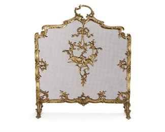 4213
A French Louis XV-Style Brass Firescreen
Early 20th century
With metal wire mesh in a polished brass frame
30.75" H x 25.75" W x 9.35" D
Estimate: $300 - $500
