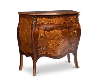 4214
A Continental Rococo-Style Walnut Bombe Commode
20th century
With a serpentine top above a conforming case fitted with three drawers, decorated with sprays of floral marquetry and gilt-metal mounts
32" H x 34" W x 14" D
Estimate: $300 - $500