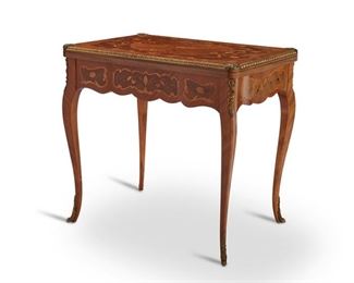 4215
A Louis XV-Style Game Table
Early 20th century
With floral marquetry inlay, gilt bronze mounts, and felt gaming surface on the interior
30.25" H x 31.75" W x 23" D
Estimate: $600 - $800