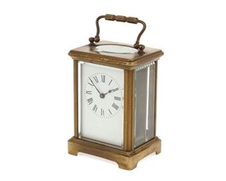 4217
A French Carriage Table Clock
Late 19th/early 20th century
Case with a Black, Starr & Frost, New York retail label
The clock with black Roman numeral hour markers and outer minute track in glazed brass case, together with the original velvet-lined, leather-wrapped wood case
Clock (handle up): 5.75" H x 3.25" W x 2.5" D; case: 5.75" H x 4" W x 4" D
Estimate: $300 - $500