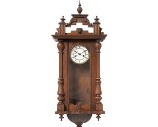 4218
A Viennese Regulator Clock
Late 19th century
The enameled brass dial with black Roman Numeral hour markers, outer minute track, and two train movement, set in a carved walnut case with turned wood design, finials, and a glazed door
38" H x 15.75" x 7.5" D
Estimate: $500 - $700