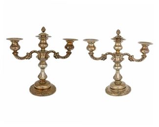 4220
A Pair Of Sterling Silver Weighted Candelabra
Mid-20th century
Marking obscured on underside
Each with convertible columns, 2 pieces
Each: 11.25" H x 12" W x 4.5" D
Estimate: $400 - $600