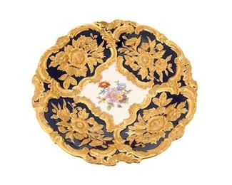 4226
A Meissen Gold And Enameled Porcelain Cabinet Plate
Circa 1934-1945
Marked for Meissen: [blue crossed swords] / Z985 / 332980 / 331
With cobalt enameling and handpainted floral spray in the center of the dish
2" H x 11" Dia.
Estimate: $300 - $500