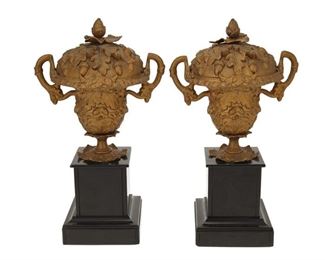 4242
A Pair Of Gilt-Metal Lidded Urns
Late 19th century
Each lidded urn with all-over acorn and oak leaf motif, raised on black marble pedestal bases, 2 pieces
Each: 14" H x 8" W x 6.25" D
Estimate: $200 - $300