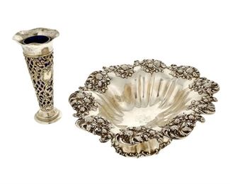 4253
Two Sterling Silver Holloware Table Items
Late 19th/early 20th century
Each marked for sterling, with maker's marks
Comprising a Mauser Art Nouveau-style bowl with strawberry border (4.5" H x 13.5" W x 11.25" D) and a Gorham pierced trumpet vase with cobalt blue glass liner (8.5" H x 4" Dia.), 2 pieces
31.84 oz. troy approximately
Estimate: $300 - $500