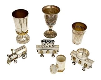 4257
A Group Israeli Judaica Sterling Silver Items
20th century
Most marked for sterling, with various maker's marks; one train car appears unmarked
Comprising a Havdalah train, three Kiddush cups, and a pair of salt and pepper shakers, 8 pieces
Largest: 5.25" H x 2.5" Dia.
22.48 oz. troy approximately
Estimate: $500 - $700