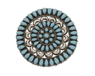 4285
A Large Cluster-Set Navajo Turquoise Pendant/Brooch
Late 20th century
Stamped: GH [possibly for George Henry, Navajo/Dine]
A round silver pendant/brooch with three concentric rows of set turquoise stones
3.25" Dia.
54.8 grams gross
Estimate: $100 - $200