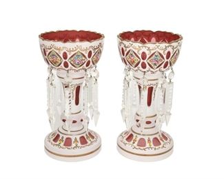 4293
A Pair Of Bohemian Cut-Glass Lusters
Late 19th/early 20th century
Each art glass luster cut from opaque white to translucent red with enameled floral motifs and gilt highlights, suspending crystal drops, 2 pieces
Each: 9.75" H x 5.25" Dia.
Estimate: $400 - $600