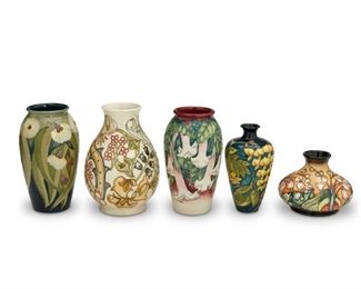 4303
A Group Of Moorcroft Pottery Vases
Late 20th/early 21st century; Burslem, England
Each with Moorcroft backstamp; with further various dates and markings
Each glazed ceramic, comprising lily, eucalyptus, datura, lily of the valley and yellow laburnum, 5 pieces
Largest: 7.5" H x 4.5" Dia.
Estimate: $200 - $300