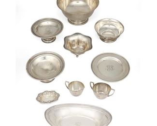 4319
A Group Of Sterling Silver Holloware
20th century
Each marked for sterling, with various maker's marks
Comprising a large footed bowl, a small footed bowl, two small compotes, an oval dish, a small fluted bowl, a small plate, a nut dish, and a creamer and sugar set, 10 pieces
Largest: 4" H x 8" Dia.
45.52 oz. troy approximately
Estimate: $600 - $800