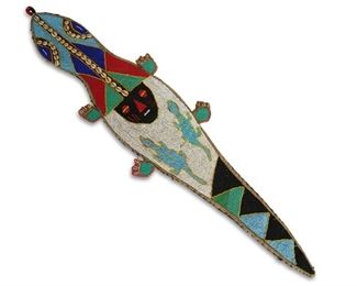 4320
A Yoruba Tribal Beadwork Ceremonial Belt
20th century; Africa
Talismanic lizard sash-style belt with seedbeads and cowrie shells adorning the fabric ground
46.125" L x 11.25" W
Estimate: $600 - $800