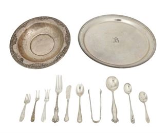 4354
A Group Of Sterling Silver Holloware And Flatware
20th century
Each marked for sterling, with various maker's marks
Comprising spoons, forks, and tongs of various forms and patterns, together with a serving bowl and charger, makers include Towle, Wallace, S. Kirk & Son, and more, 19 pieces
Largest: 11" Dia.
40.895 oz. troy approximately
Estimate: $500 - $700