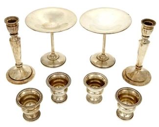 4359
A Group Of Weighted Sterling Silver Holloware
20th century
Each marked for sterling, with various maker's marks
Each variously patterned, comprising a pair of Peruvian candlesticks, a pair of compotes, and four small cups, 8 pieces
Largest: 6.125" H x 6" Dia.
Estimate: $300 - $500