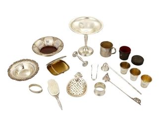 4363
A Group Of Sterling Silver Table Items
20th century
Most marked for sterling, with various maker's marks
Comprising a a weighted Towle compote, a Reed & Barton pierced dish, a Towle pierced dish, a Tiffany & Co. pineapple dish, a small brush, an unmarked cigarette case, a child's cup, two napkin rings, a pair of Gorham sugar tongs, two candle snuffers, a baby's rattle, and a set of travel cups in a leather case, 14 pieces
Largest: 6.125" H x 6.125" Dia.
Weighable sterling: 19.51 gross oz. troy approximately
Estimate: $400 - $600