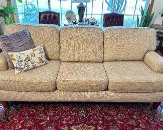 Lovely wheat color sofa.