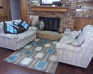 Pair of loveseats and rugs